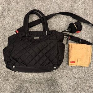 Storksak Black Quilted Baby Bag Bow detail